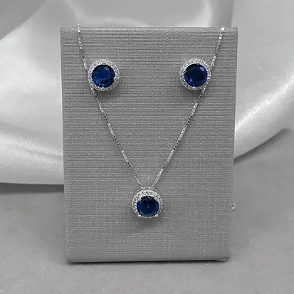 CONJUNTO REDONDO ZIRCÔNIA AZUL DETALHE CRAV