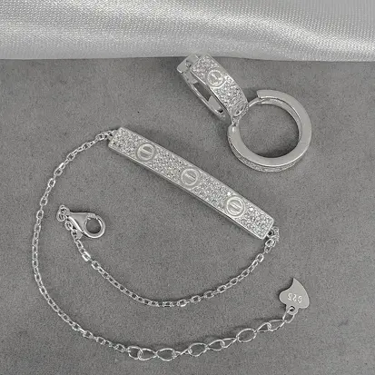 CONJUNTO PULSEIRA E BRINCO CARTIER CRAVEJADOS