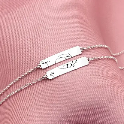 PULSEIRA 2 PLAQUINHAS CORAÇÃO NOMES